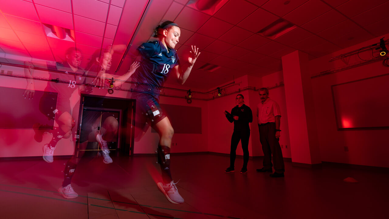 A soccer player running in the human motion lab