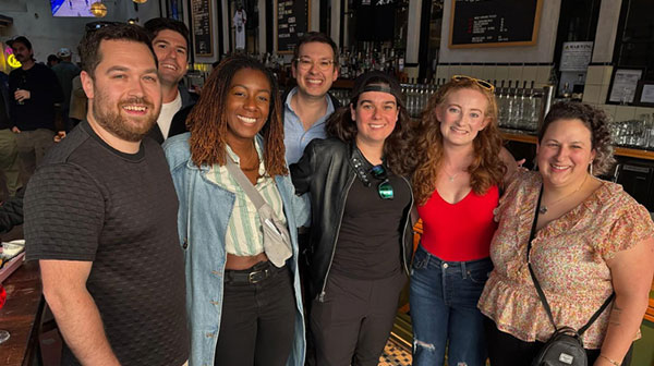 Quinnipiac alumni posing for a picture at an event.