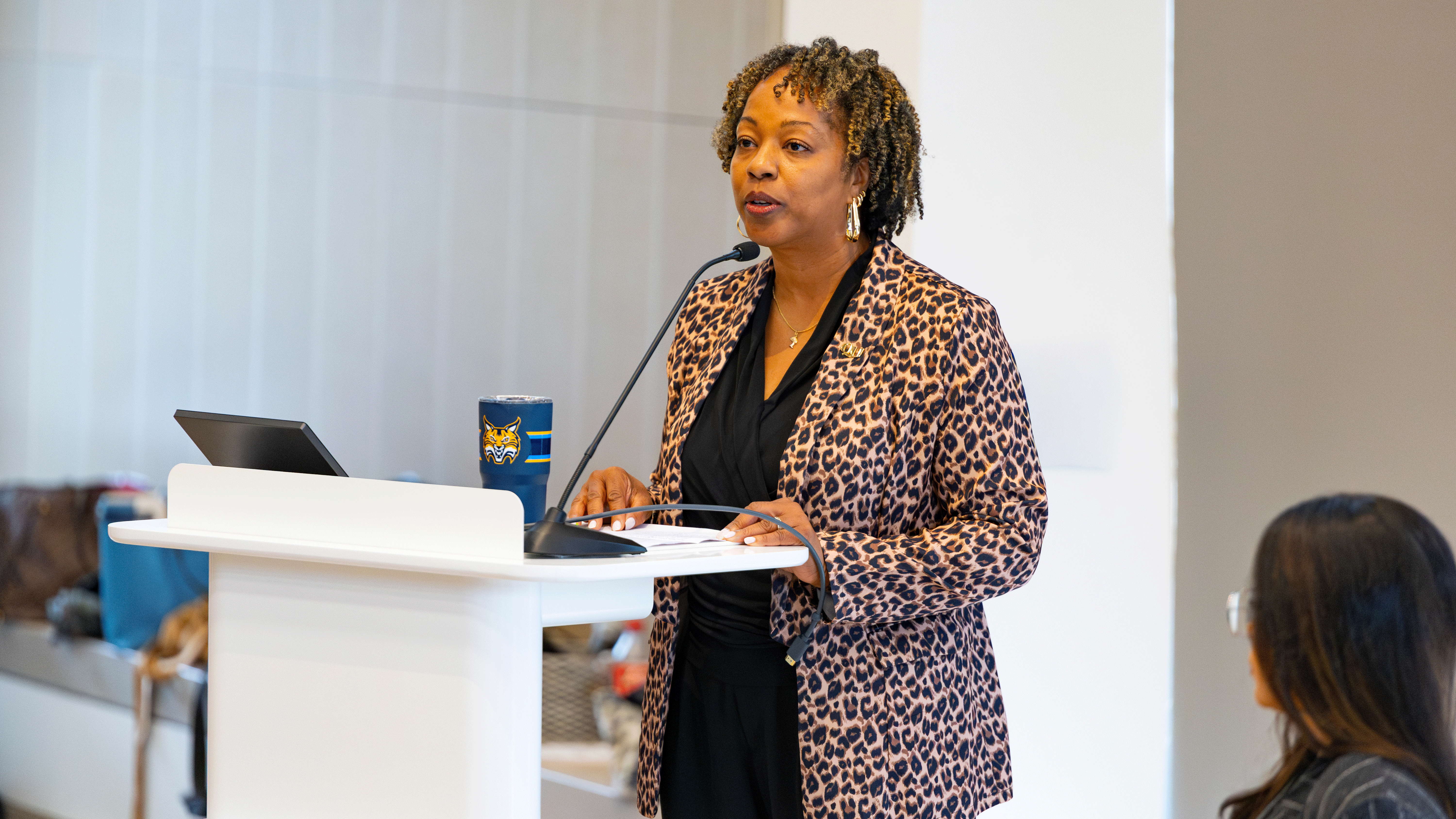 Nadine Barnett talking at a podium