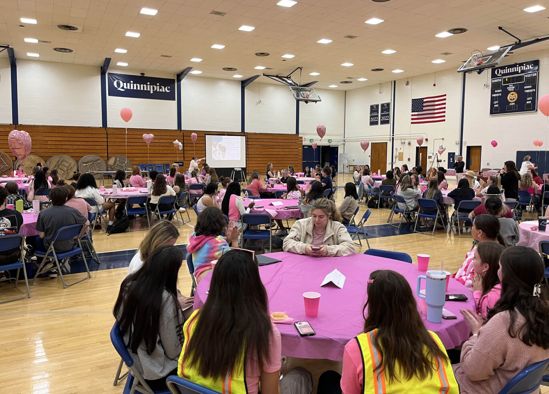 Students and faculty dressed in pink attend the Barbie discussion party in the Burt Kahn Court.