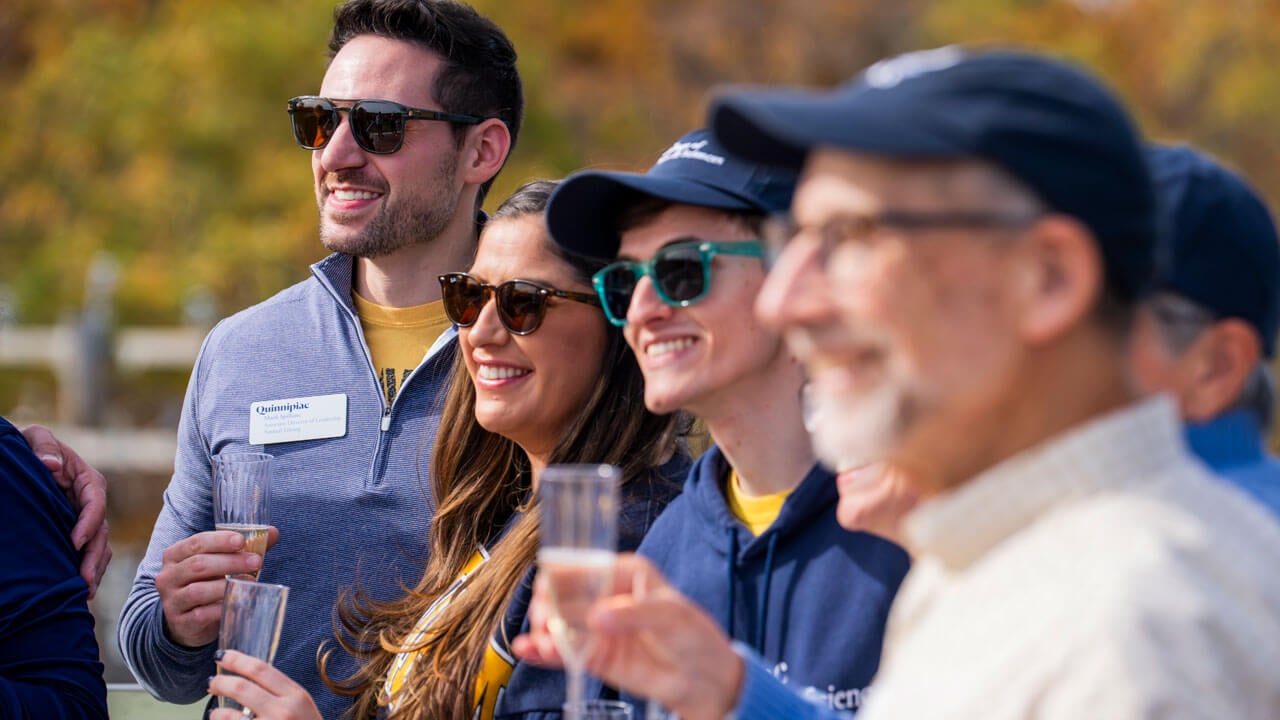 Couples gather to watch a toast