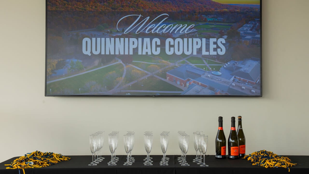 Sign that reads "Welcome Quinnipiac Couples"