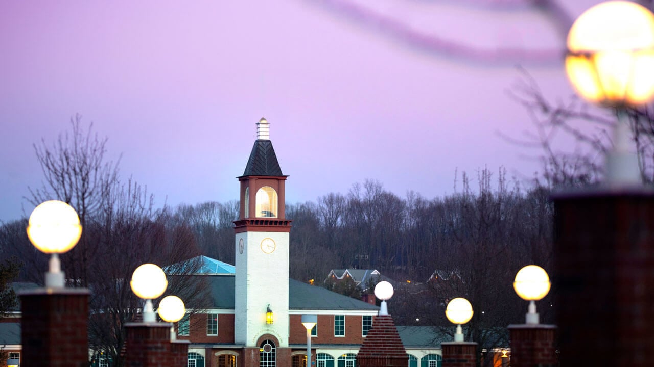 A purple sunrise behind the Quinnipiac clocktower.