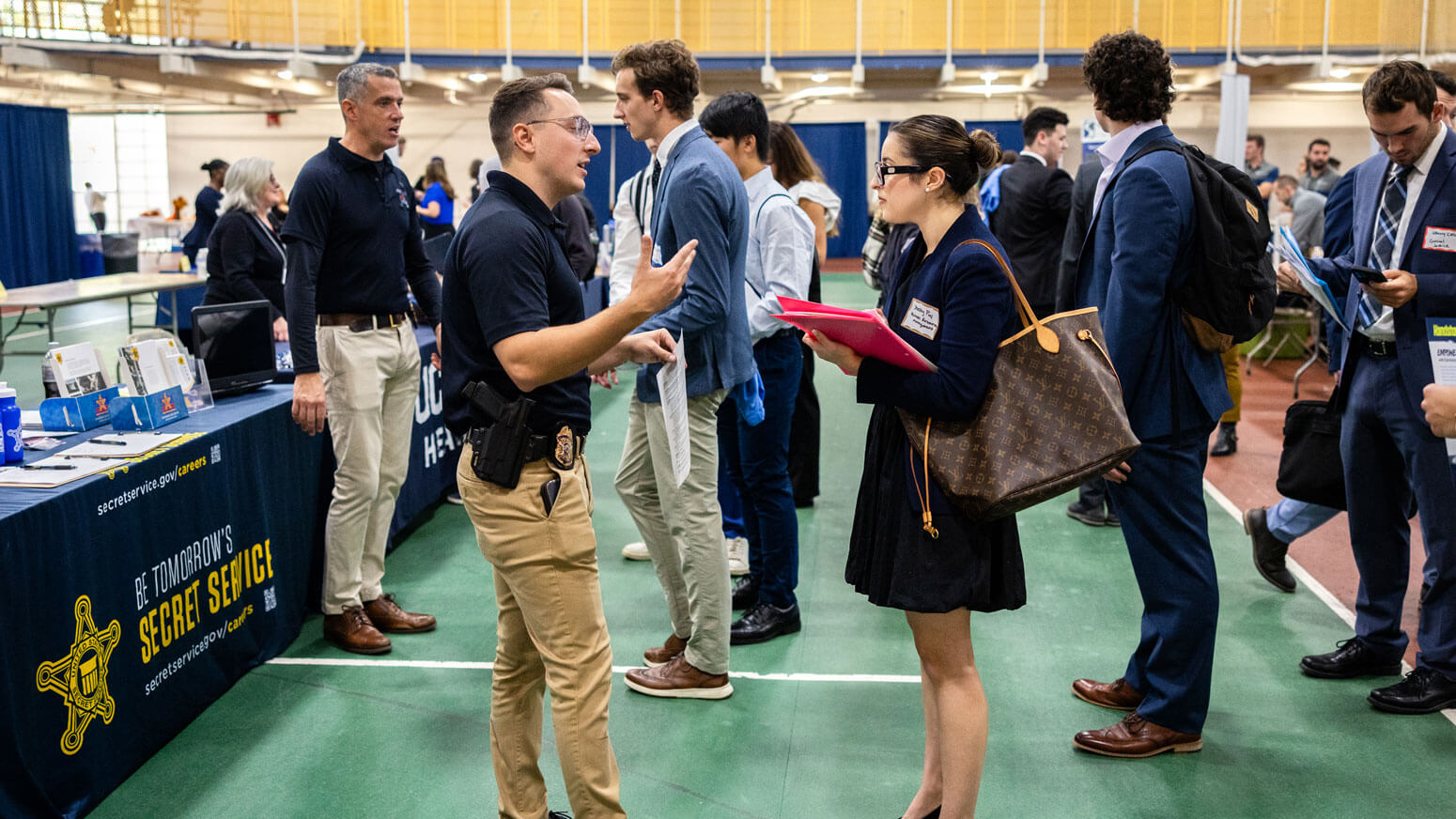 Students interact with brand representatives during the University career fair.
