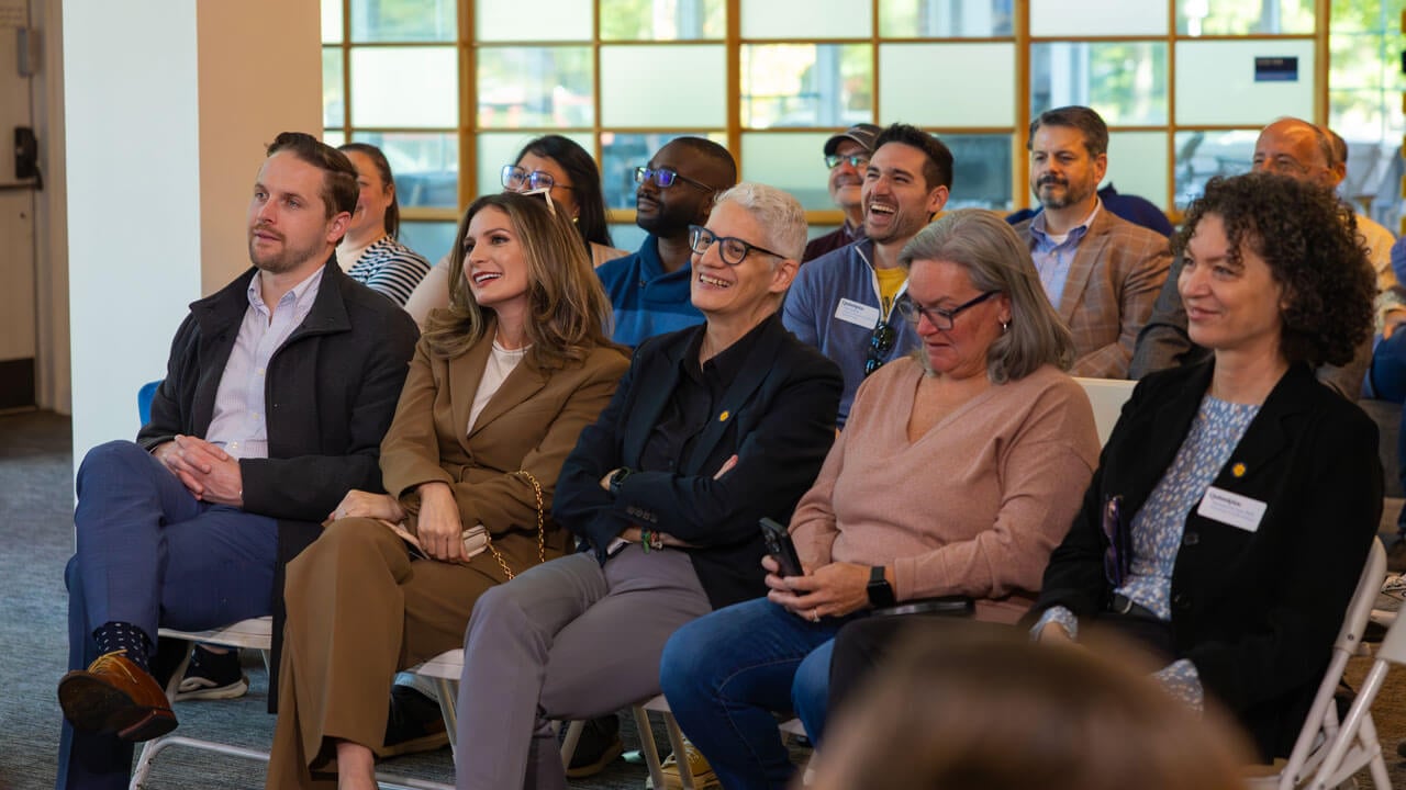Crowd looks up and watches speakers and presenters