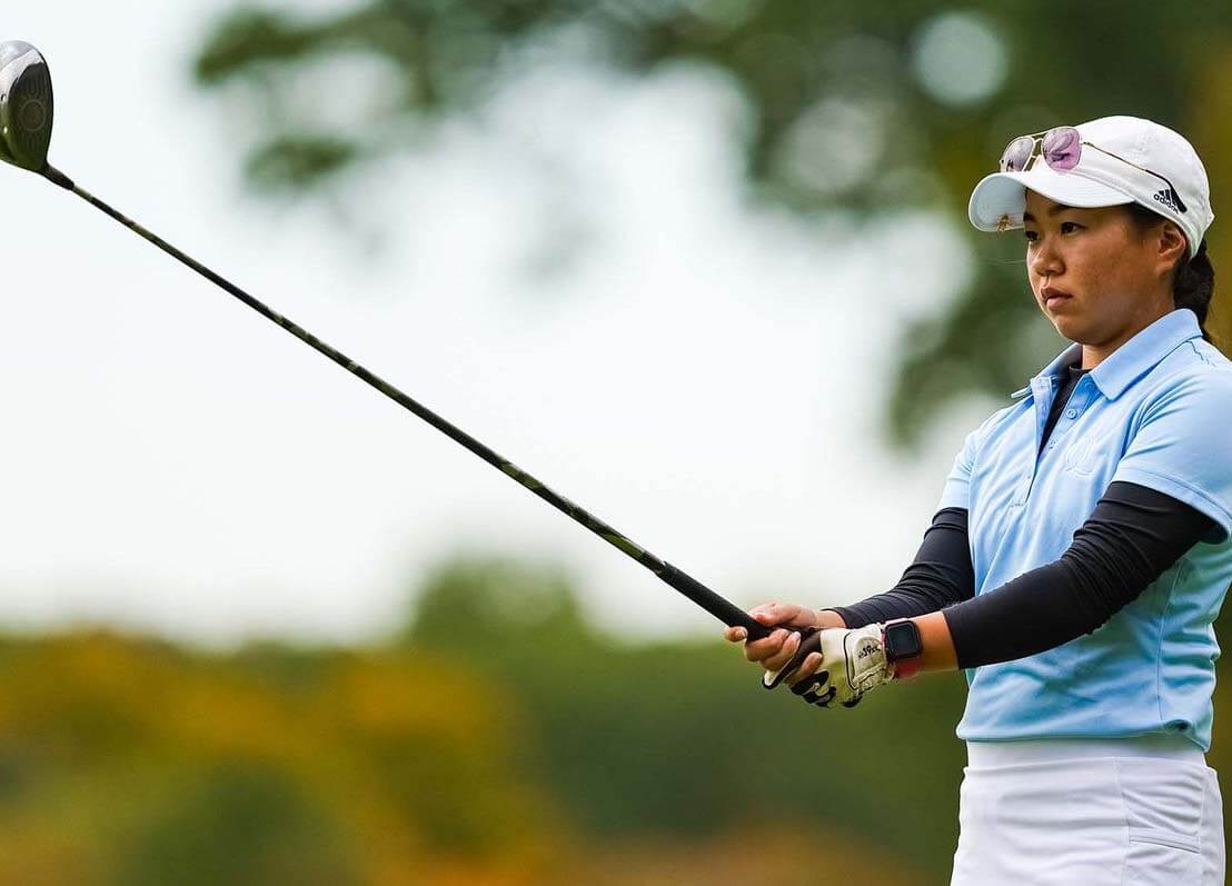 Kaylee Sakoda lines up her golf club