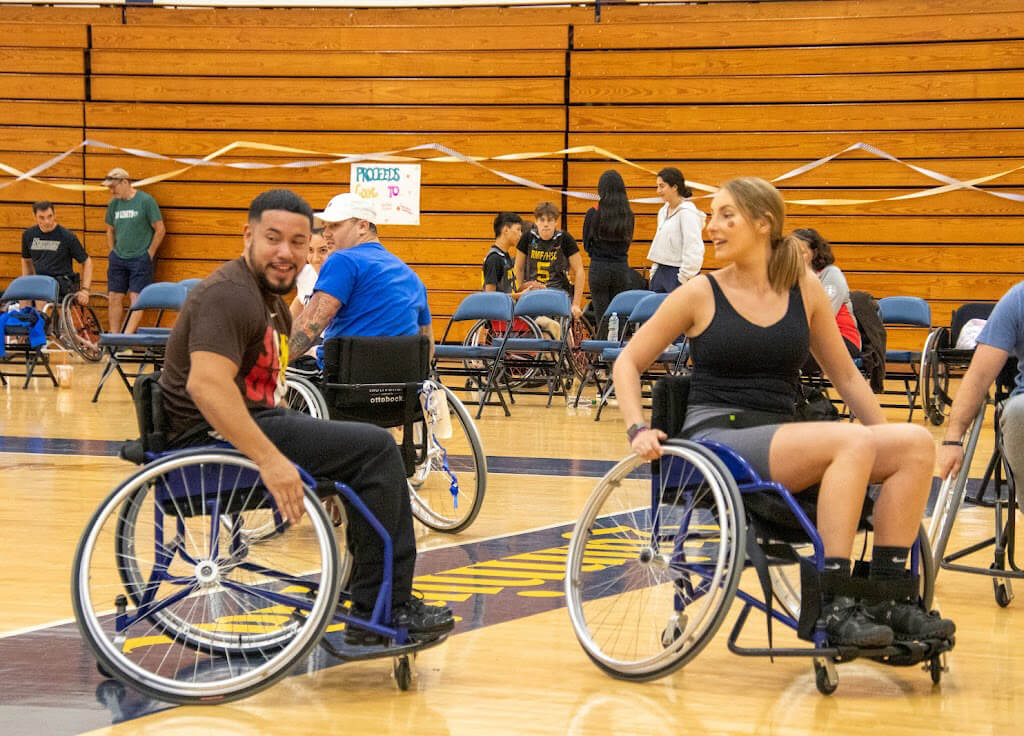'Wheels in Motion' participants play basketball