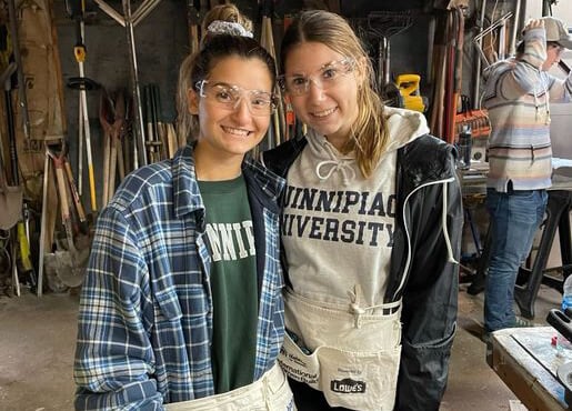 Brianna Eberle and Carly Donoghue at a Habitat for Humanity build