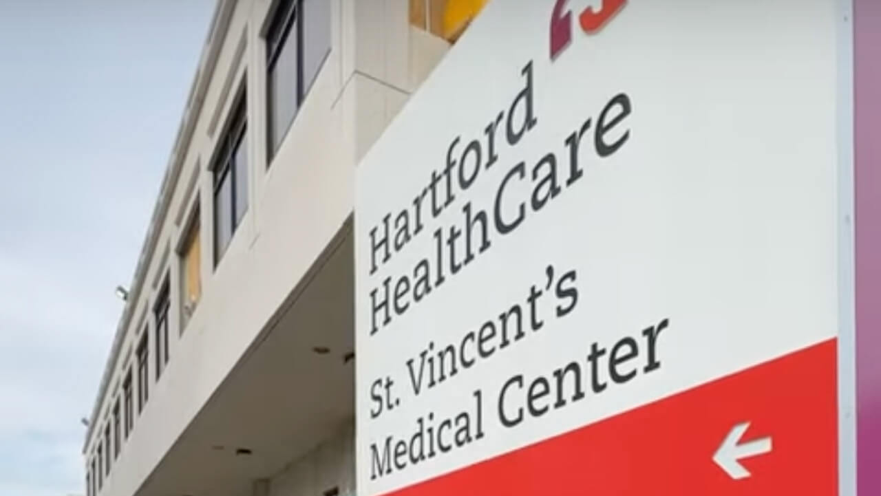 Sign of St. Vincent Medical Center, plays video