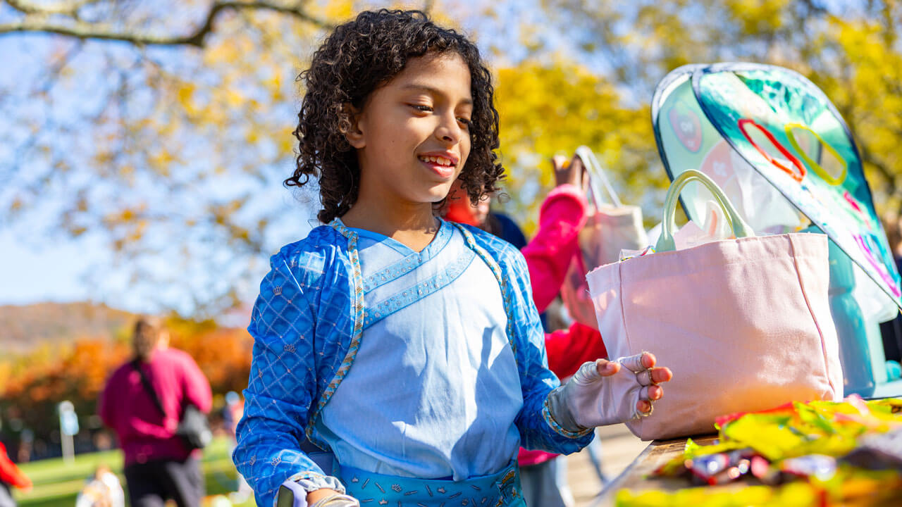 Child enjoying candy at Boomer's Boo Bash
