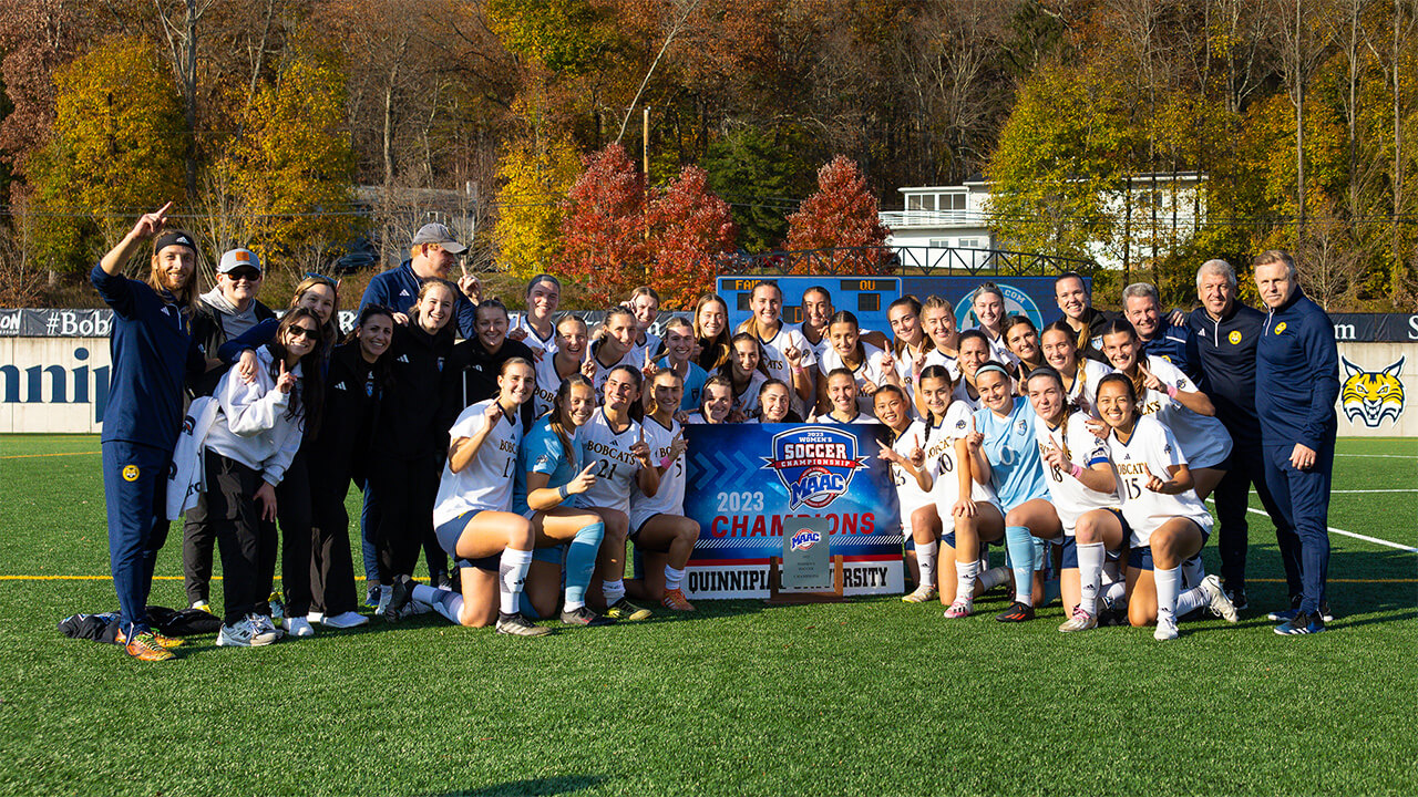Womens soccer team poses after winning the MAAC championship