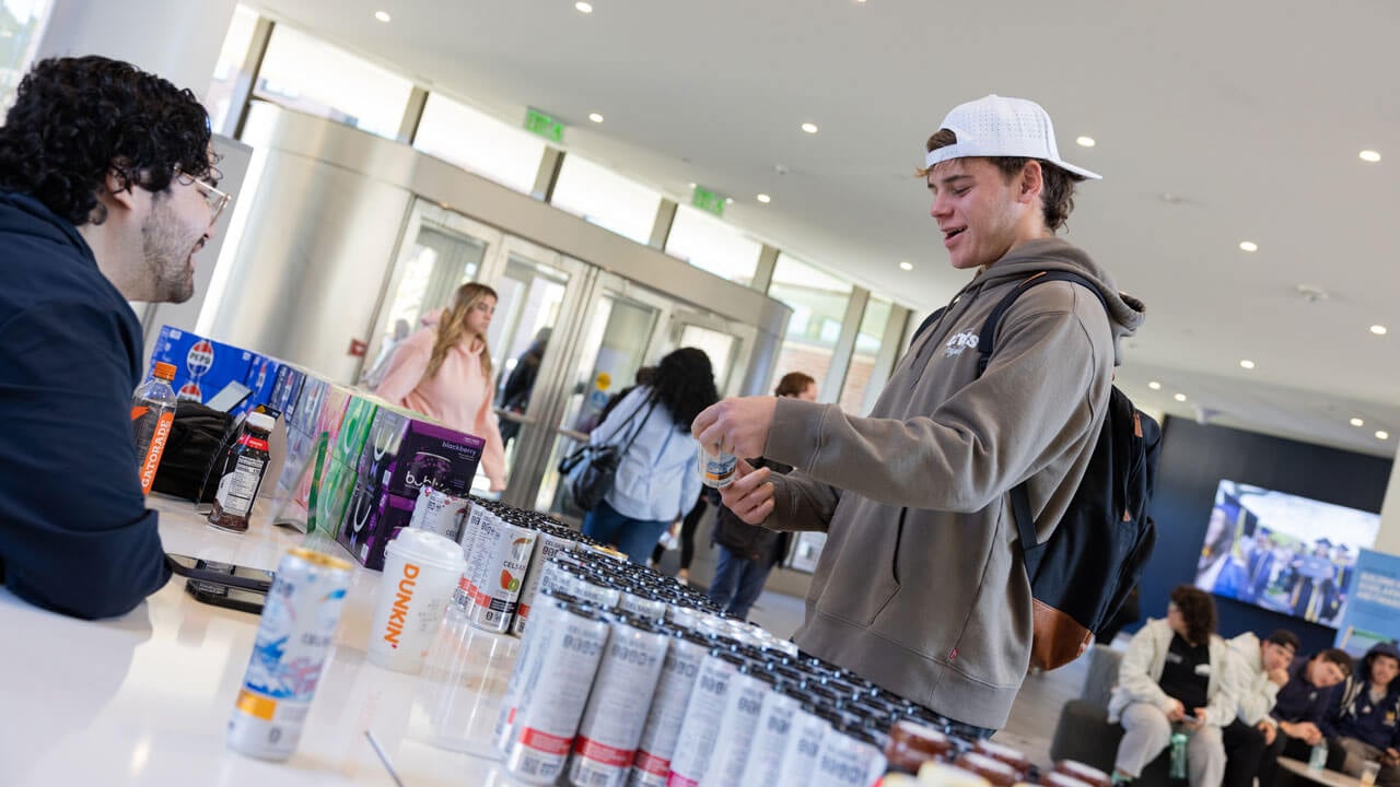 Student explores pepsi products on display