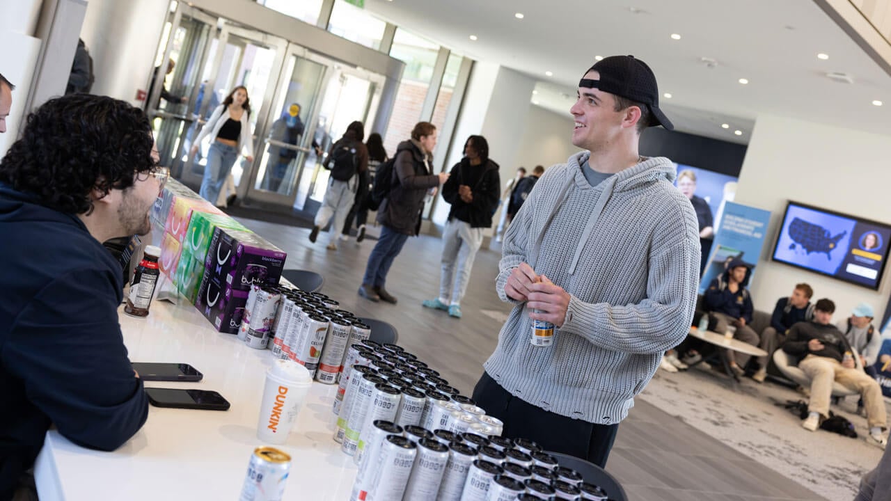 Student explores pepsi products on display