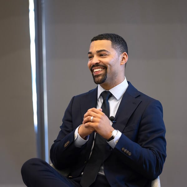 State Treasurer Erick Russell is shown seated and smiling during his Critical Conversation in the School of Business.