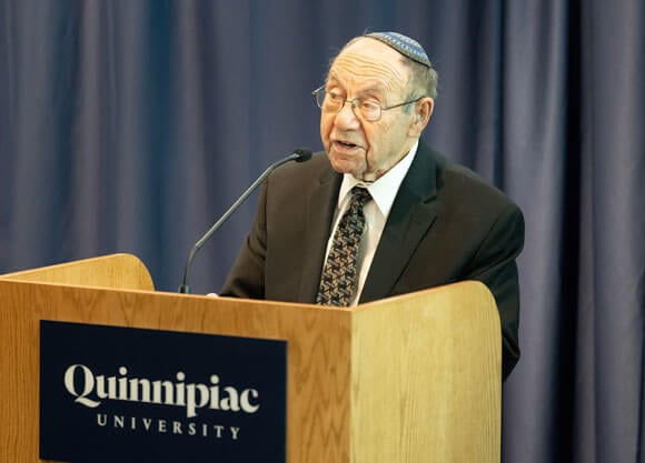 Rabbi Philip Lazowski, 92, addresses the crowd in the Mount Carmel Auditorium on Holocaust Remembrance Day.