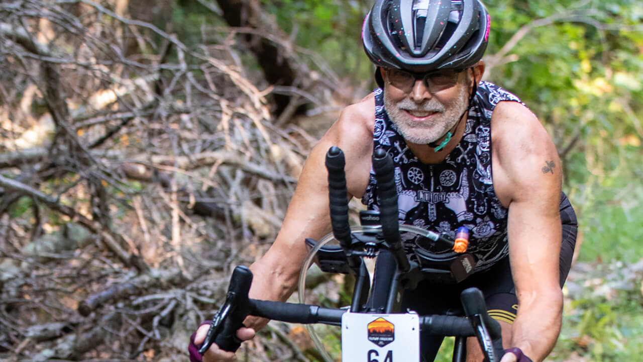 School of Law professor John Thomas rides his bike on the Great Divide Mountain Bike Route.