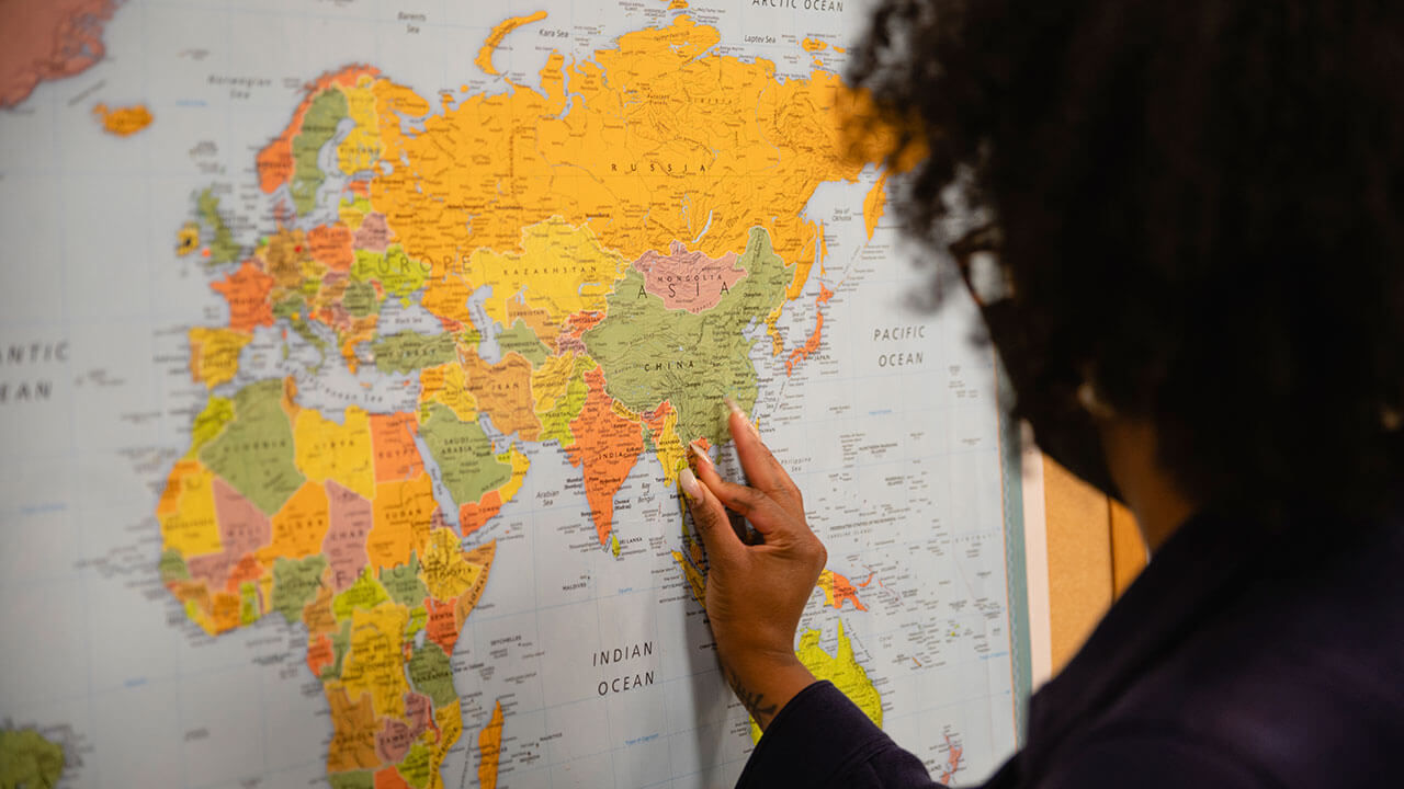 Student interacts with a world map