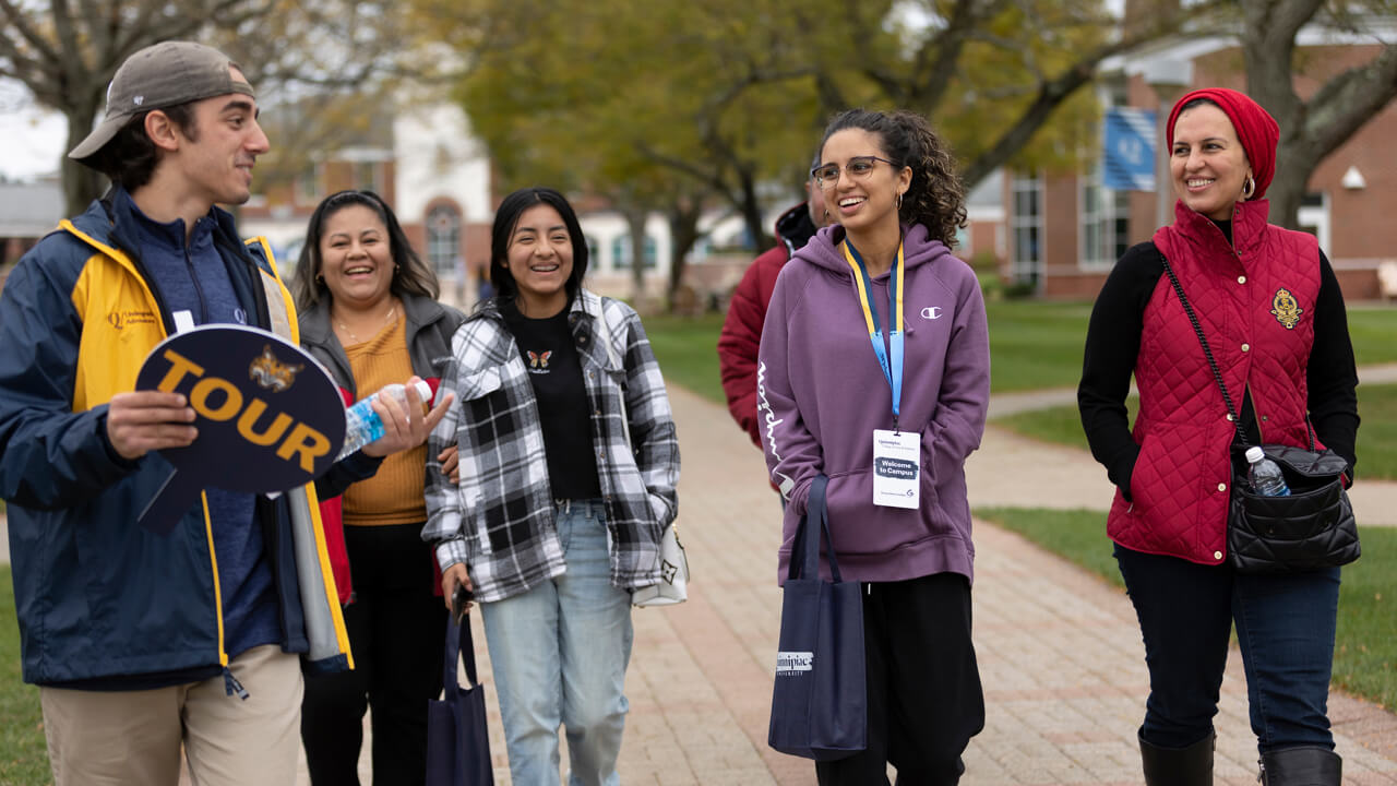 Prospective students and their families take a tour of Quinnipiac campuses during Open House