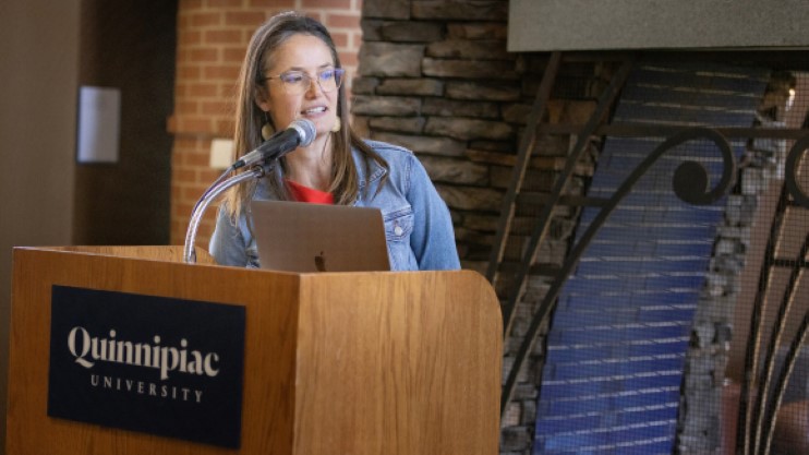 Professor Julia Giblin Speaks Behind Podium