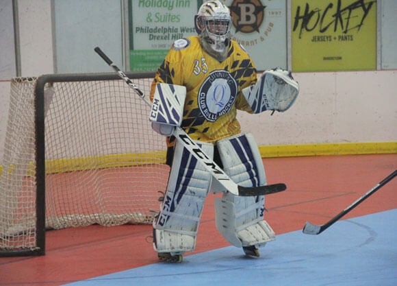 Andrew Miller goaltends in Quinnipiac roller hockey gear.