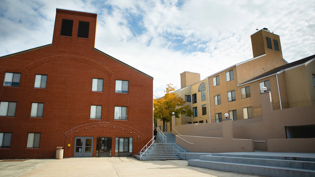 An outdoor courtyard surrounded by residence hall buildings