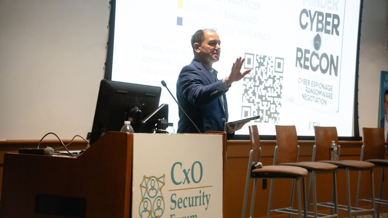 Presenter speaks on stage