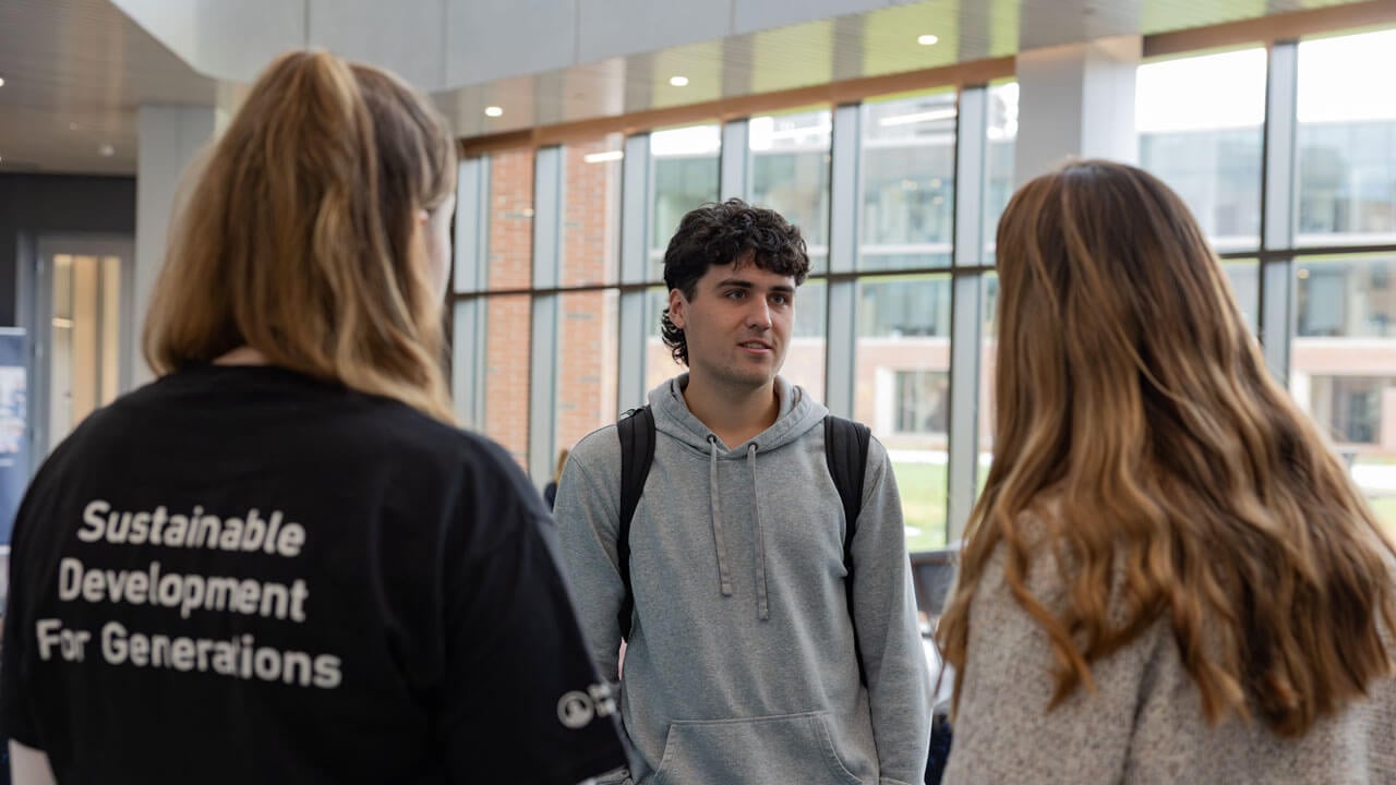 Students talking in the SITE building