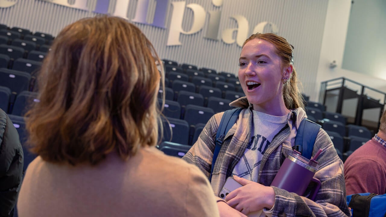Student talking to a Boehringer Ingelheim panelist speaker