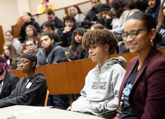 Students sit in on an education symposium
