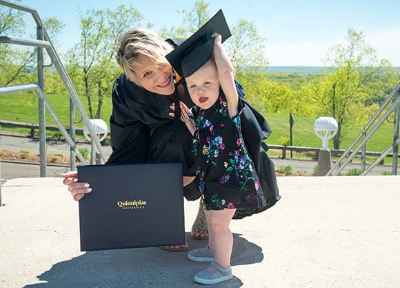 Rebeca Caruso  with her daughter at Quinnipiac University graduation ceremony
