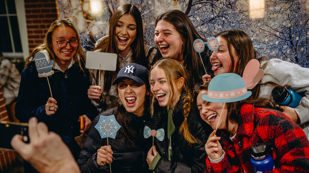 Group of students cheering in holiday dinner photo