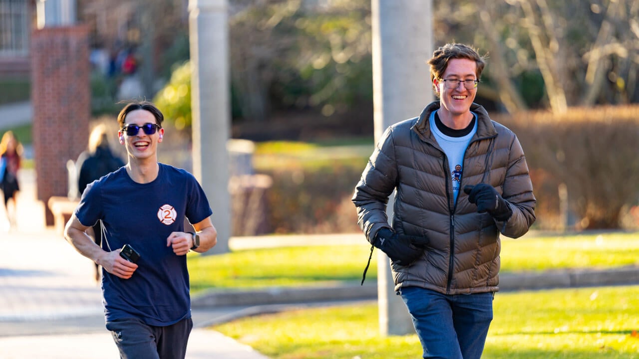 Individuals running the 2025 Jingle Bell Fun Run