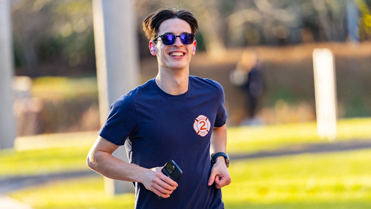 Participant of the 2025 Jingle Bell Fun Run smiles