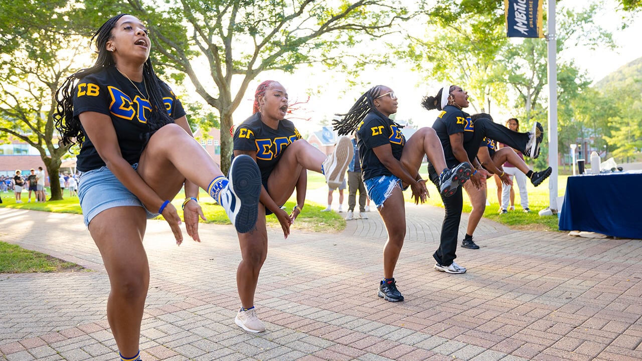Sorority members dance together