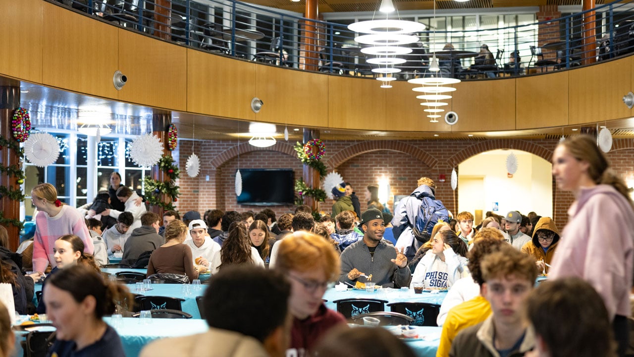Overview of the Quinnipiac dining hall as students enjoy the holiday dinner