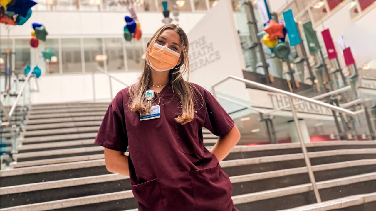 Francesca Marchiano posing for a picture in her scrubs