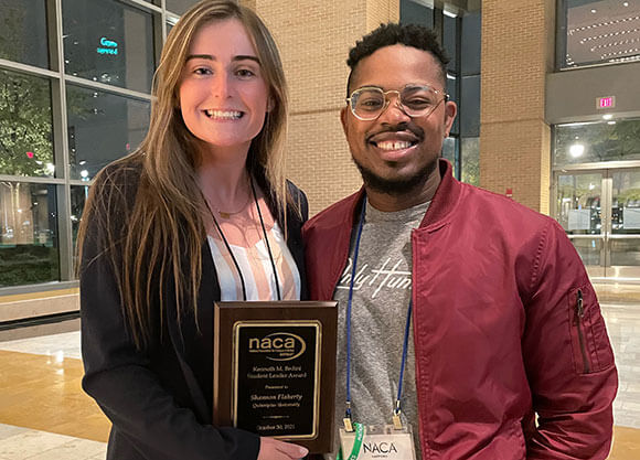 Photo of Shannon Flaherty and Jahmil Effend holding an award