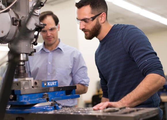 Professor John Reap and student, working in the School of Engineering’s machine shop.