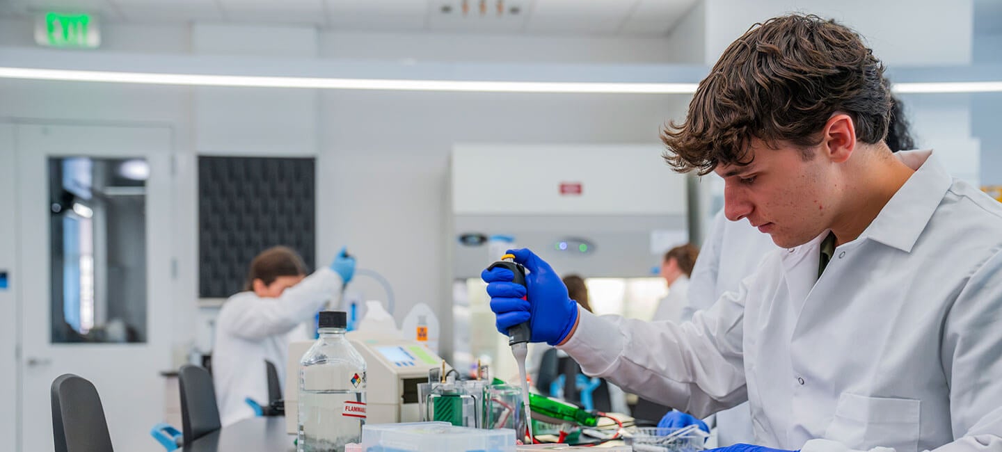Student works with test tubes at The SITE