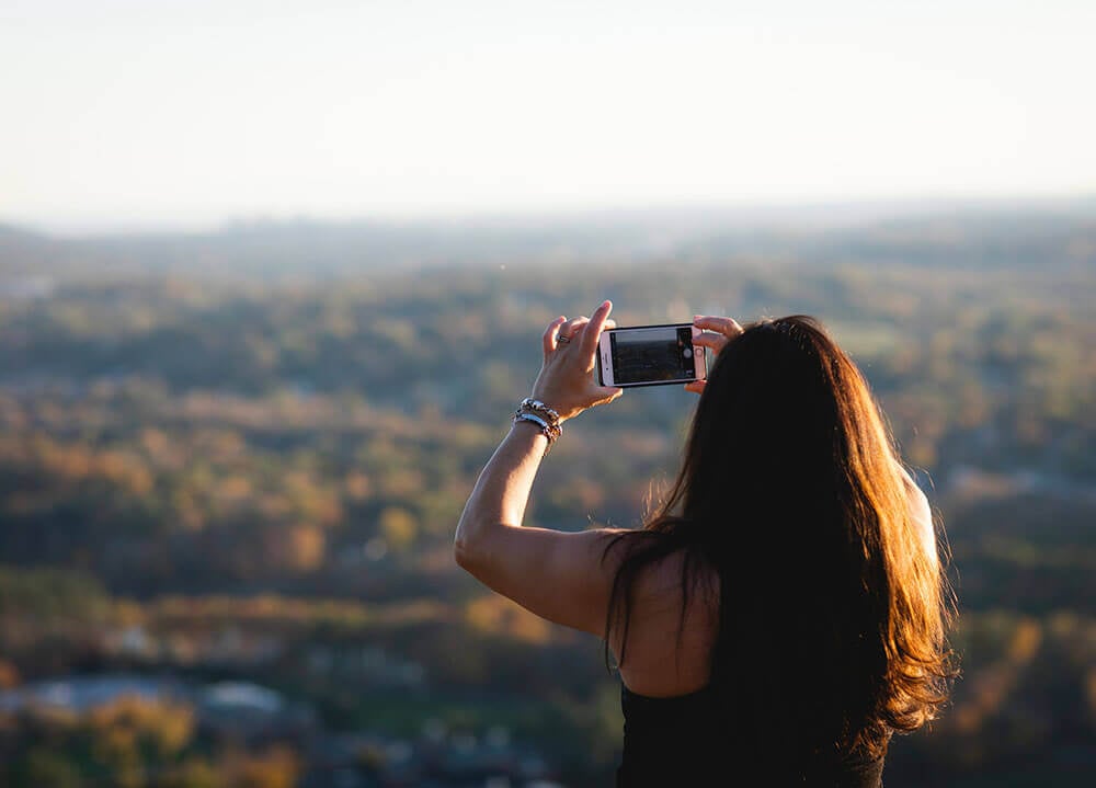 Woman takes photo from Sleeping Giant