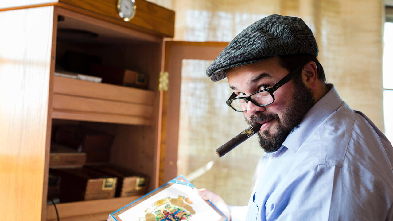 Nicholas Melillo displays a box of his premium cigars.