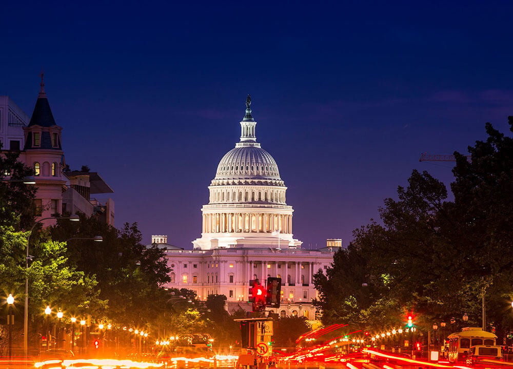 The US Capitol building glows at night in downtown Washington, D.C.