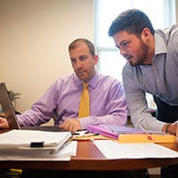 Chris Roberts works with Michael Taylor, assistant dean of academic services