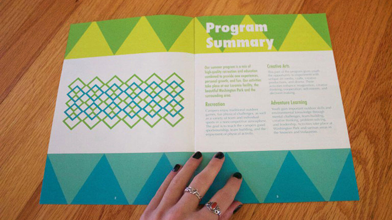 An example of graphic design student work, a printed program showcasing blues and greens