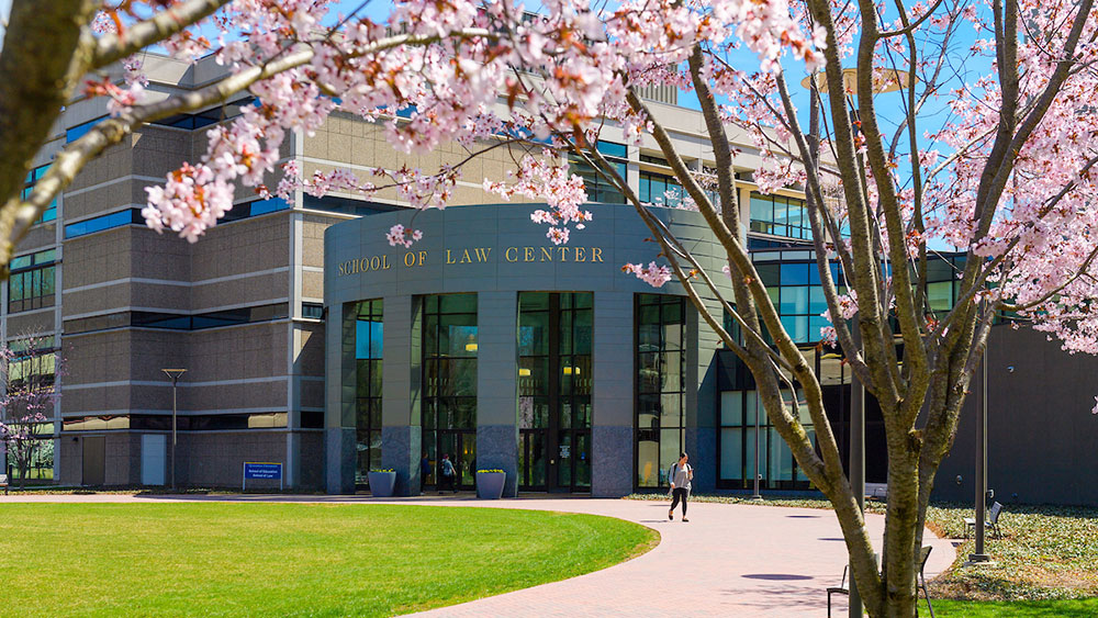 Exterior shot of the School of Law Center building on a spring day