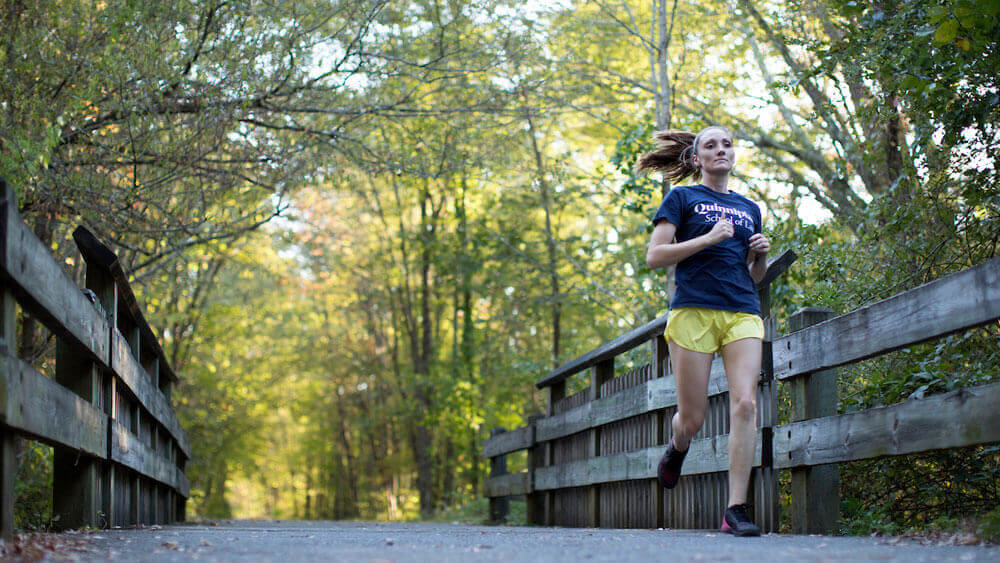 Shannon Haggerty, J.D. ’21. runs on the Farmington Rail Trail near the Quinnipiac University campus.