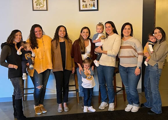 Alumna Ali Warshavsky is pictured with her Bobcat friends and their children.