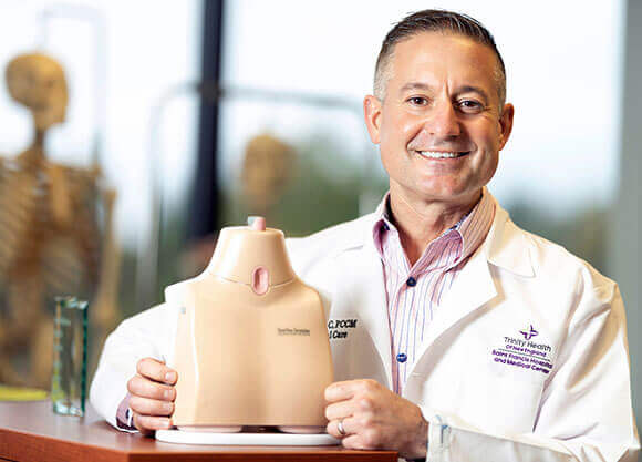 Pete Sandor holding the ClearView Tracheostomy Trainer