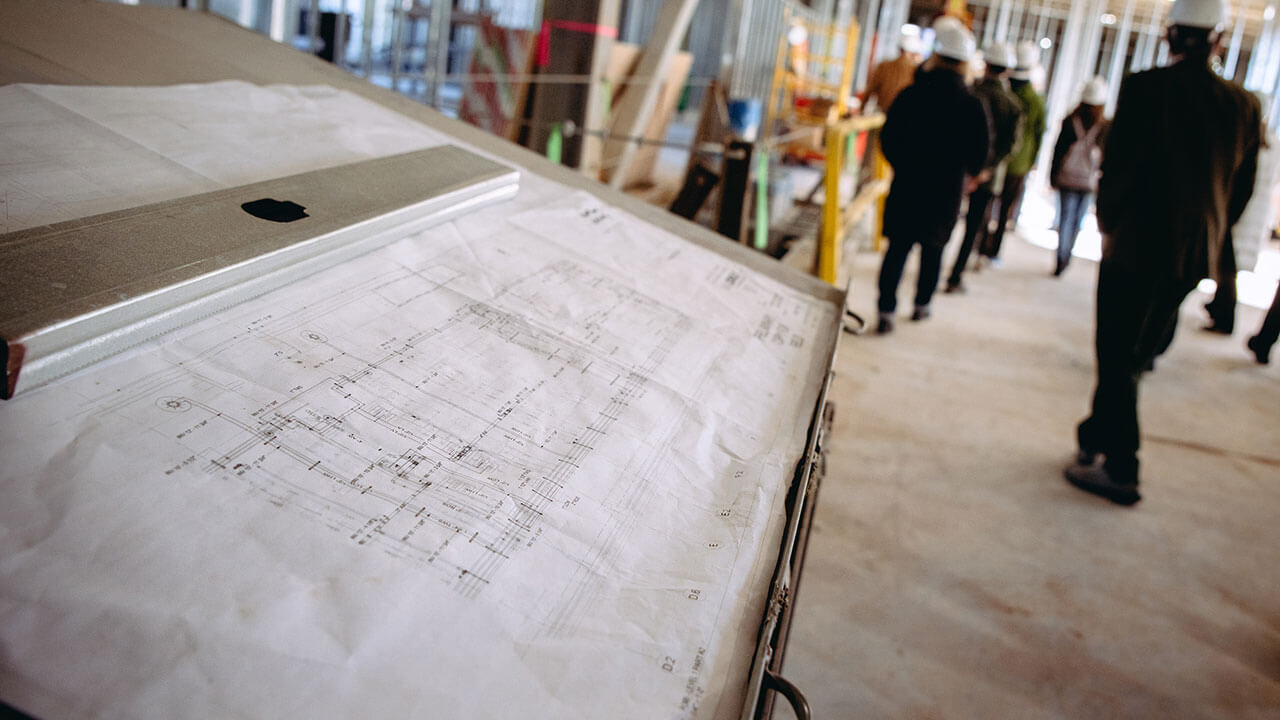 An up-close photo of blueprints in a building on the South Quad.