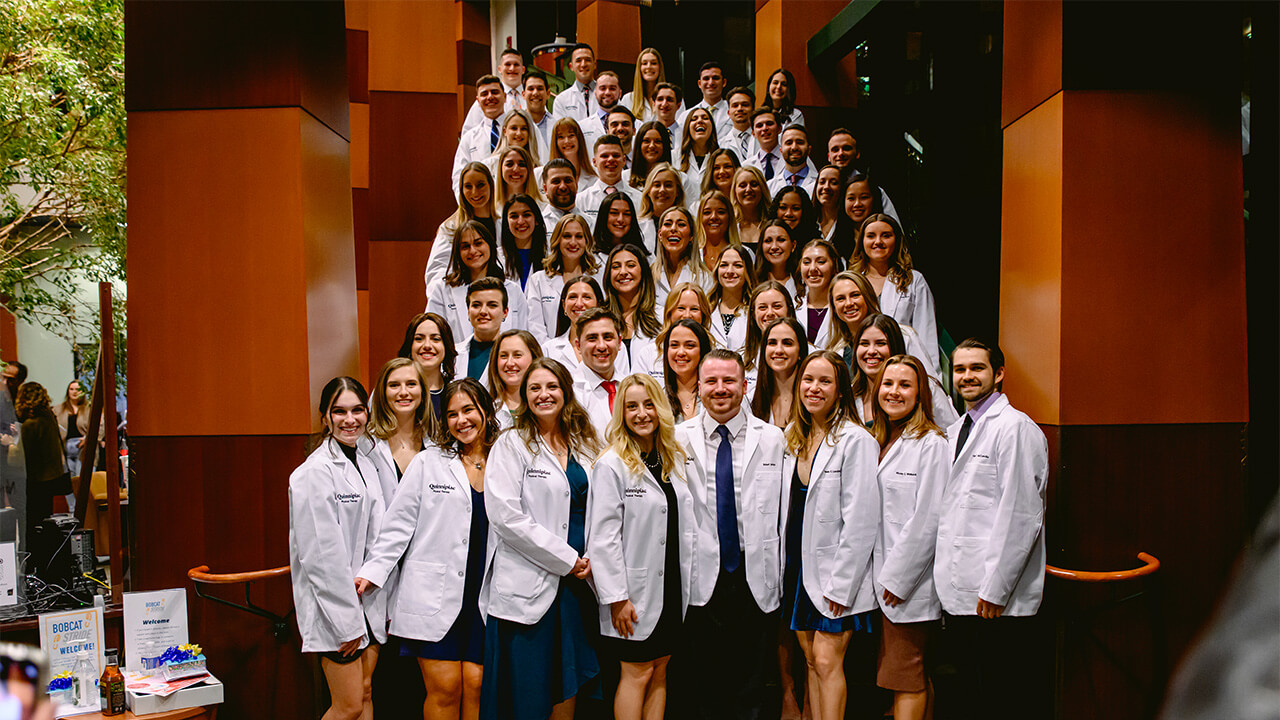 The DPT Class of 2023 stands on steps posing for a class photo.